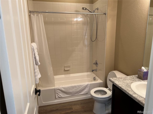 full bathroom featuring shower / bath combination with curtain, wood-type flooring, toilet, and vanity