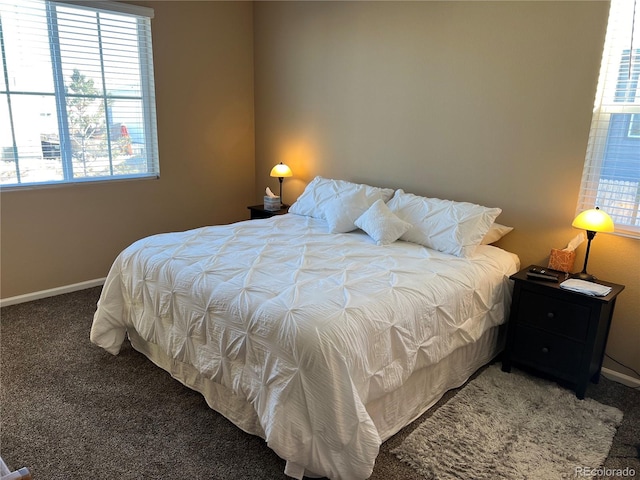 bedroom featuring dark carpet