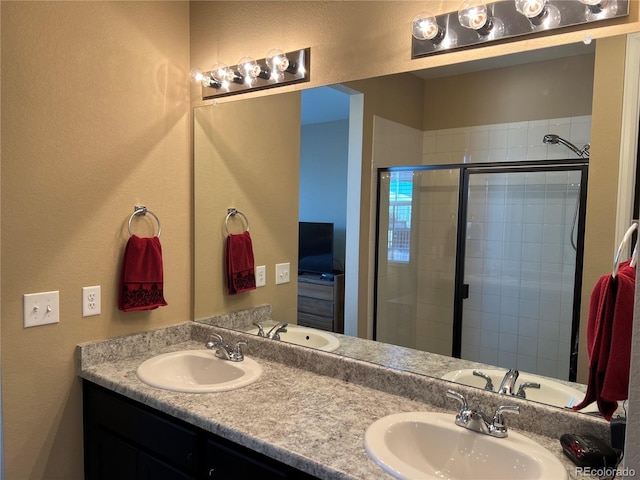 bathroom with vanity and an enclosed shower