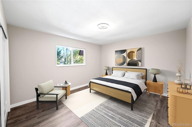 bedroom with hardwood / wood-style floors