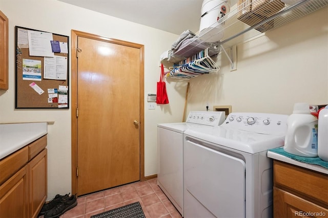 12963 W 84th Pl, Arvada, CO 80005 - washroom with washing machine and clothes dryer, cabinet space, and light tile patterned flooring