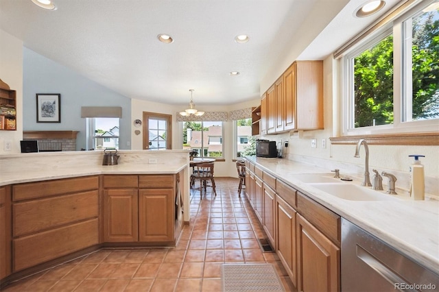 12963 W 84th Pl, Arvada, CO 80005 - kitchen featuring stainless steel dishwasher, healthy amount of natural light, light countertops, and recessed lighting