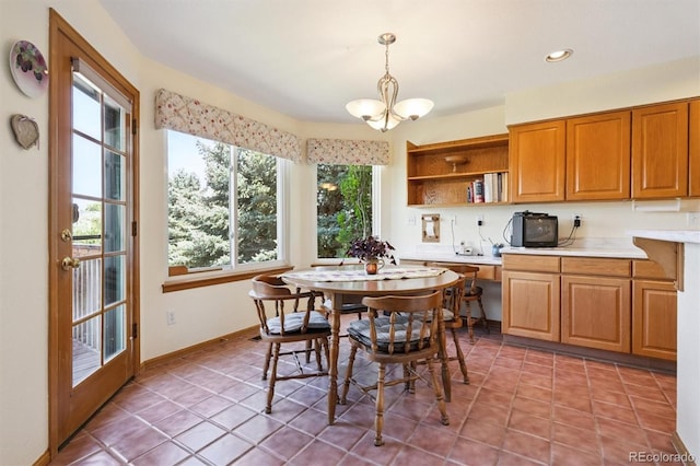 12963 W 84th Pl, Arvada, CO 80005 - dining room with a chandelier, light tile patterned flooring, and recessed lighting