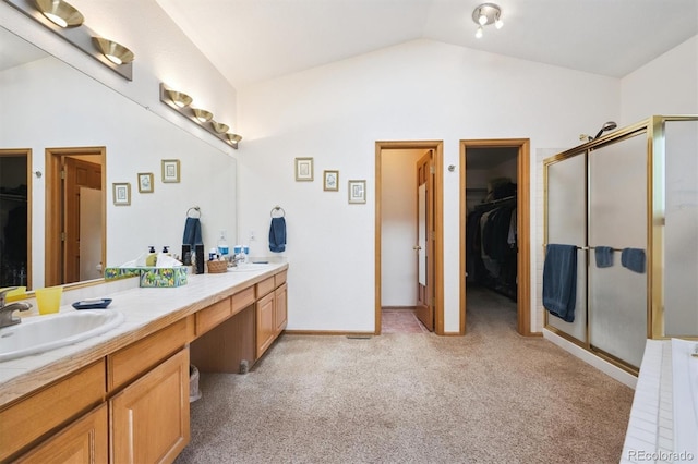 12963 W 84th Pl, Arvada, CO 80005 - bathroom with carpet floors, double vanity, lofted ceiling, and a stall shower