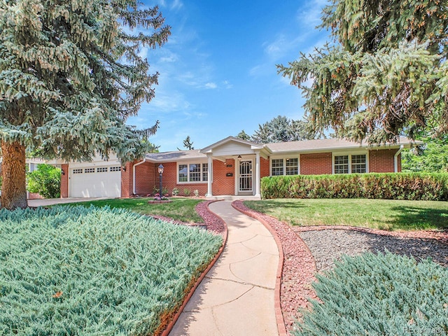 5895 W Plymouth Dr, Littleton, CO 80128 - ranch-style house with brick siding, a front yard, and a garage