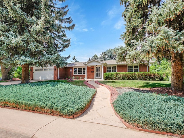 5895 W Plymouth Dr, Littleton, CO 80128 - ranch-style house featuring a front yard, brick siding, a garage, and driveway