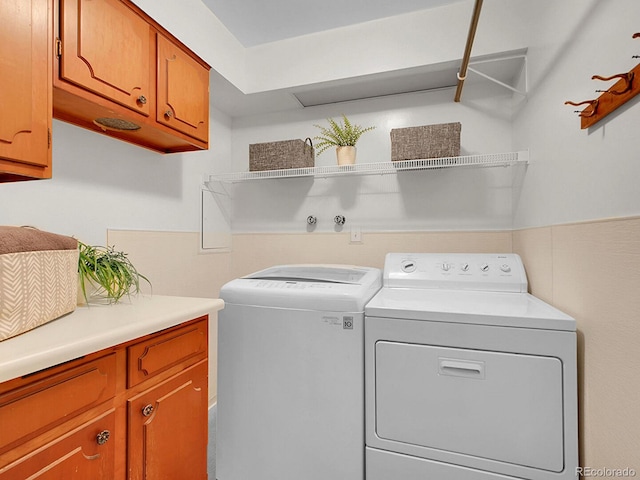 5895 W Plymouth Dr, Littleton, CO 80128 - laundry area featuring separate washer and dryer and cabinet space