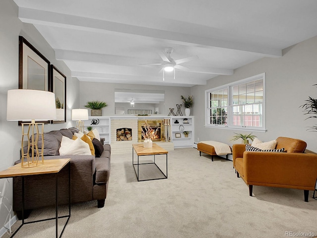 5895 W Plymouth Dr, Littleton, CO 80128 - carpeted living area featuring beam ceiling, ceiling fan, and a fireplace