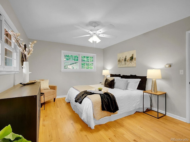 5895 W Plymouth Dr, Littleton, CO 80128 - bedroom featuring light wood finished floors and ceiling fan