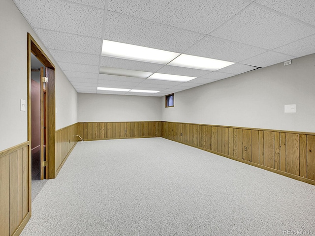 5895 W Plymouth Dr, Littleton, CO 80128 - carpeted spare room with a drop ceiling, wainscoting, and wood walls