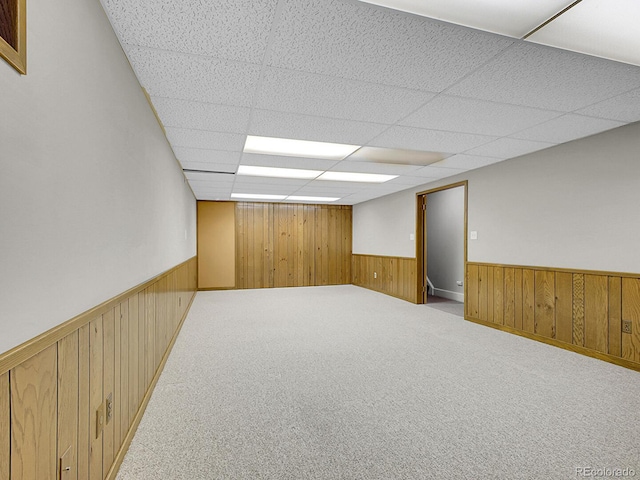 5895 W Plymouth Dr, Littleton, CO 80128 - finished below grade area with a wainscoted wall, wooden walls, a paneled ceiling, and carpet