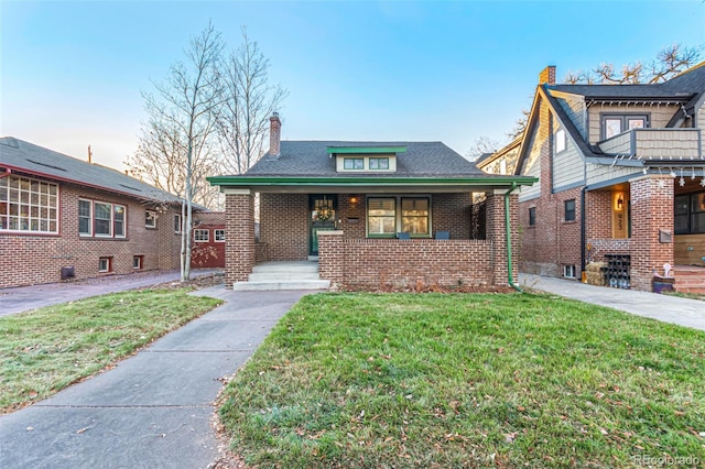 view of front of house with a lawn