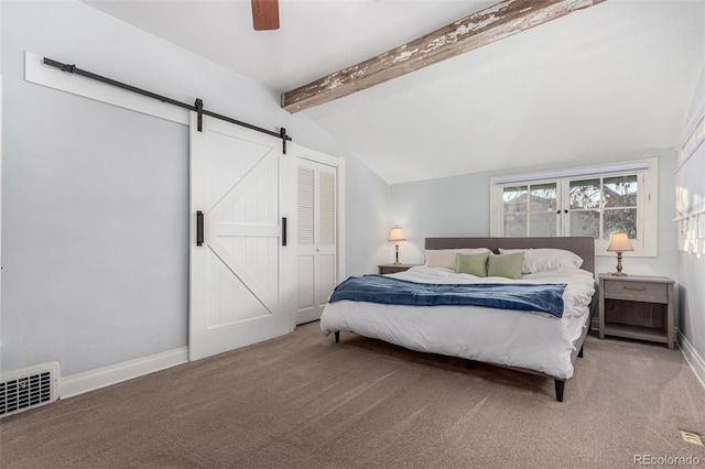 carpeted bedroom featuring a barn door, ceiling fan, a closet, and lofted ceiling with beams