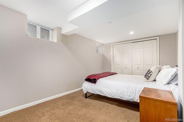 bedroom with carpet flooring and a closet