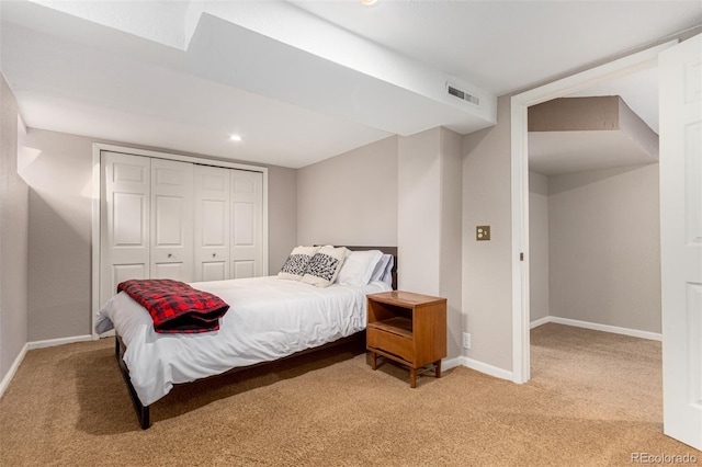 bedroom with carpet and a closet