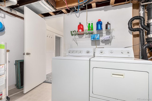 laundry room featuring washing machine and dryer and water heater