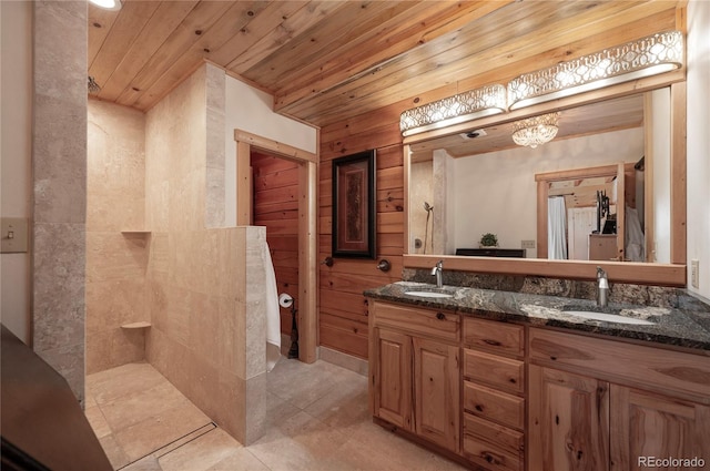 bathroom with vanity, a shower, wood walls, and wooden ceiling