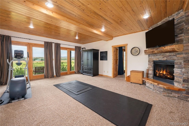 exercise room with carpet, a fireplace, and wooden ceiling