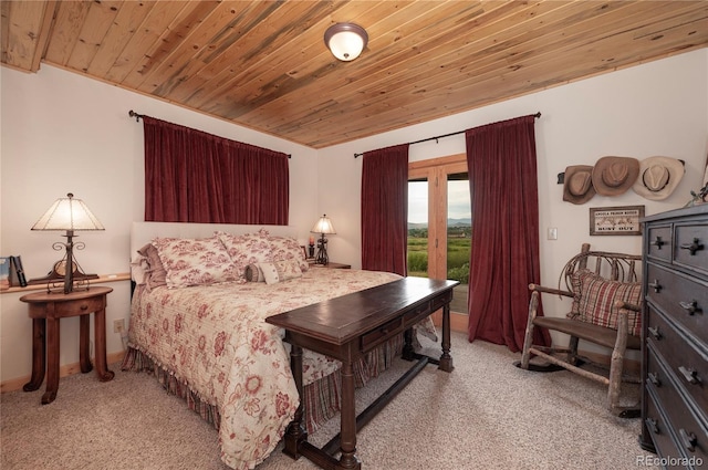 bedroom featuring wood ceiling and light colored carpet