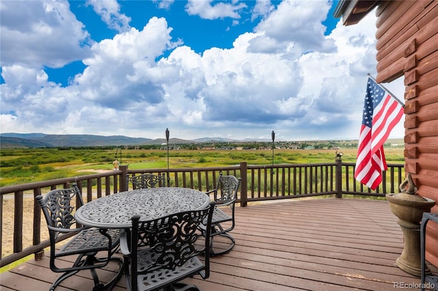 wooden deck featuring a mountain view