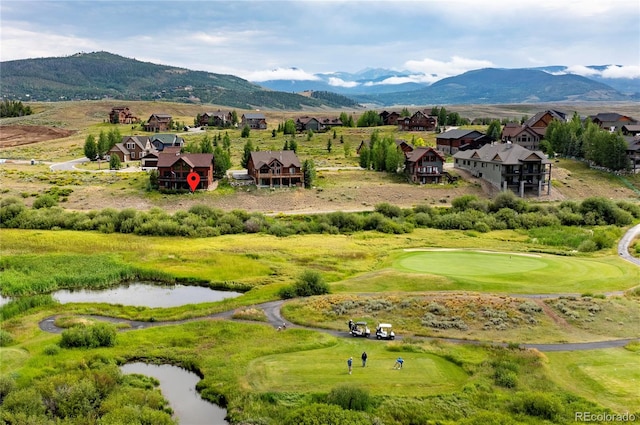 view of community featuring a water and mountain view