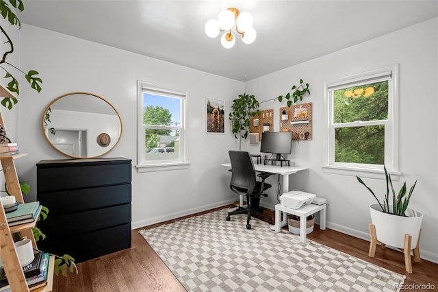 3231 S Elati St, Englewood, CO 80110 - home office featuring healthy amount of natural light, wood finished floors, a chandelier, and baseboards