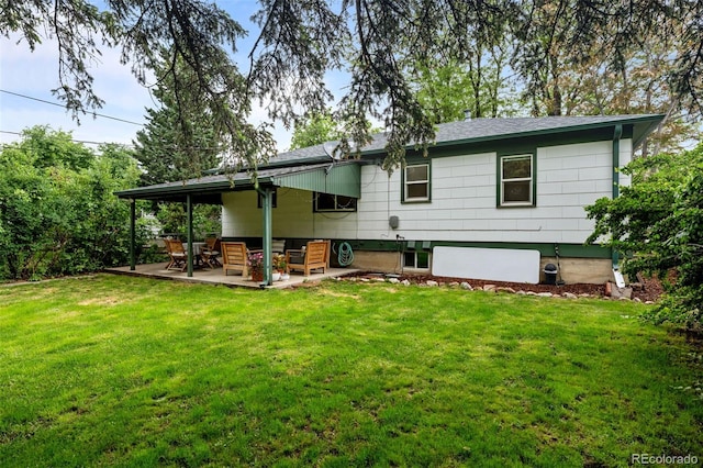 3231 S Elati St, Englewood, CO 80110 - back of house featuring a yard and a patio area