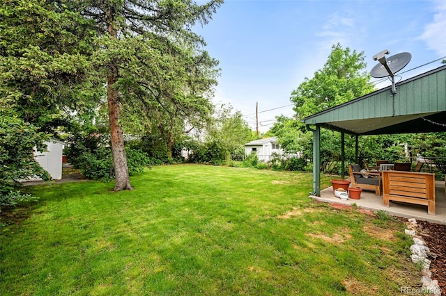 3231 S Elati St, Englewood, CO 80110 - view of yard featuring a patio and an outdoor living space