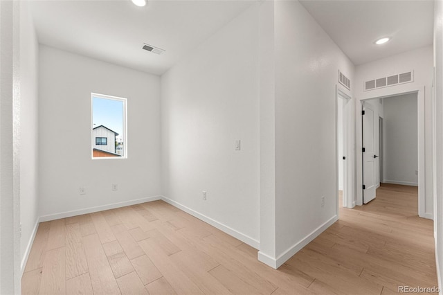 spare room with light wood-type flooring