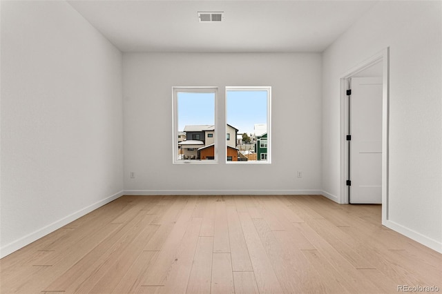 spare room with light hardwood / wood-style floors