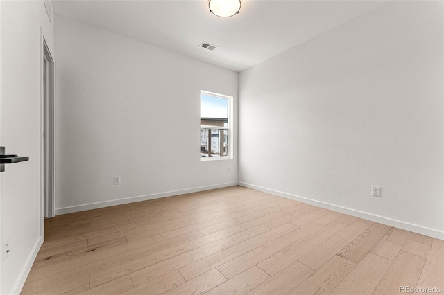 unfurnished room with light hardwood / wood-style floors