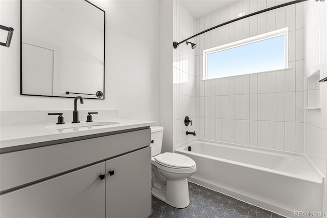 full bathroom with toilet, tiled shower / bath combo, and vanity