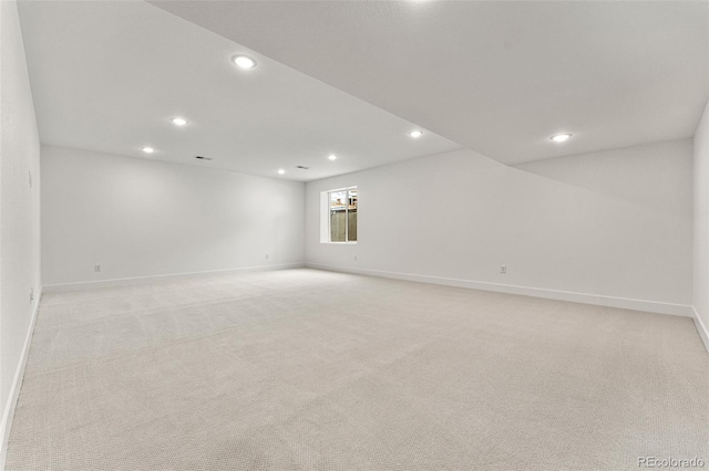 spare room with light carpet