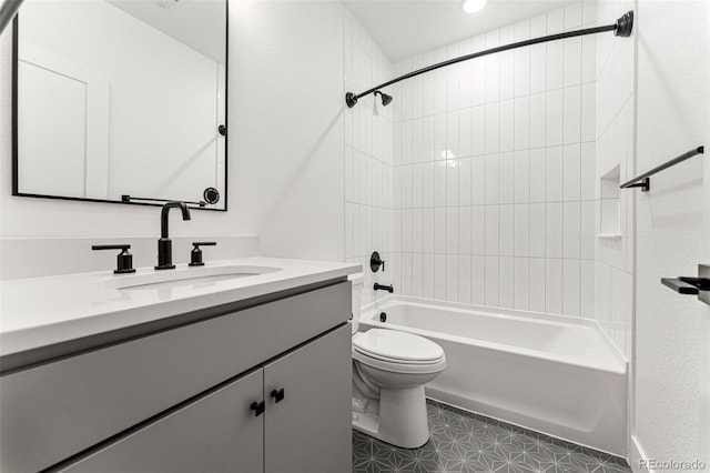 full bathroom with vanity, toilet, and tiled shower / bath