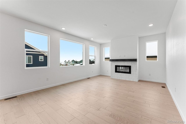 unfurnished living room featuring light hardwood / wood-style flooring