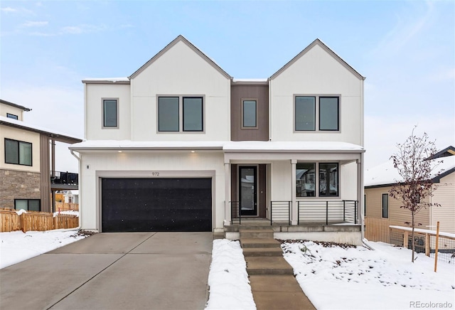 view of front of home featuring a garage and covered porch