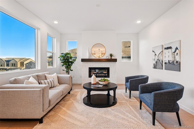 972 Arapahoe Cir, Louisville, CO 80027 - living area with a tiled fireplace, recessed lighting, baseboards, and wood finished floors
