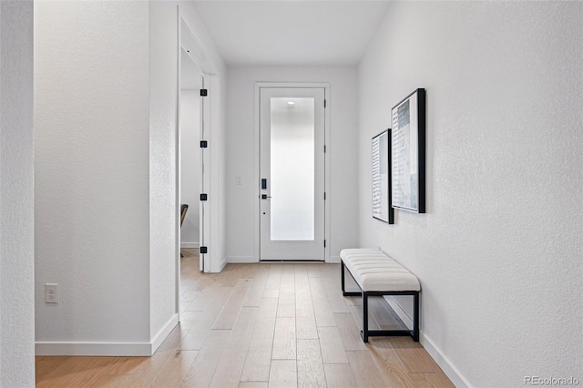 972 Arapahoe Cir, Louisville, CO 80027 - hallway featuring light wood-type flooring, baseboards, and a textured wall