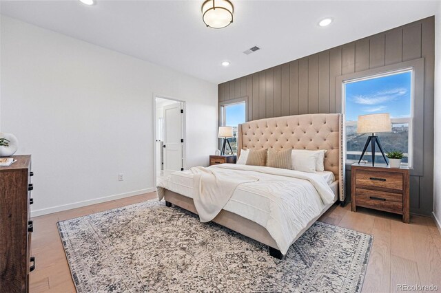 972 Arapahoe Cir, Louisville, CO 80027 - bedroom featuring wood walls, light wood-style flooring, recessed lighting, baseboards, and visible vents