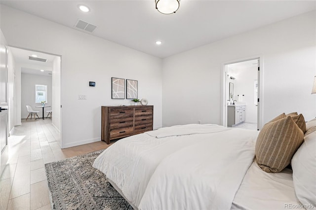972 Arapahoe Cir, Louisville, CO 80027 - bedroom with baseboards, recessed lighting, ensuite bath, and visible vents