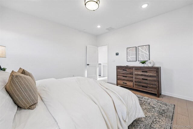 972 Arapahoe Cir, Louisville, CO 80027 - bedroom featuring baseboards, wood-type flooring, recessed lighting, and visible vents