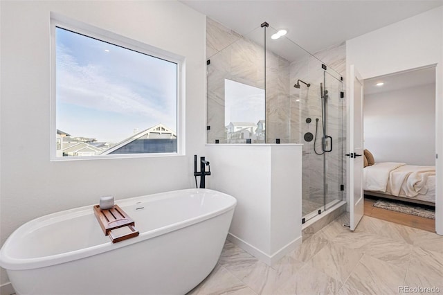 972 Arapahoe Cir, Louisville, CO 80027 - full bath with recessed lighting, a soaking tub, marble finish floor, and a stall shower