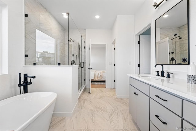 972 Arapahoe Cir, Louisville, CO 80027 - full bath with vanity, marble finish floor, a freestanding tub, baseboards, and a shower stall