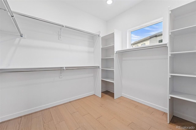 972 Arapahoe Cir, Louisville, CO 80027 - spacious closet featuring wood finished floors