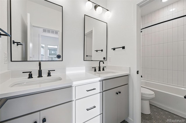 972 Arapahoe Cir, Louisville, CO 80027 - bathroom featuring a sink, shower / bathing tub combination, toilet, and double vanity