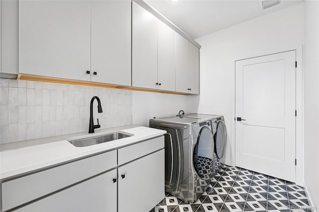 972 Arapahoe Cir, Louisville, CO 80027 - laundry area featuring cabinet space, visible vents, a sink, and washer and dryer