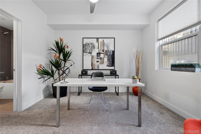 office area featuring ceiling fan and carpet floors