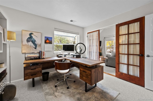 office area featuring light colored carpet