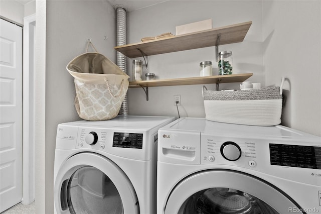 washroom with washer and clothes dryer