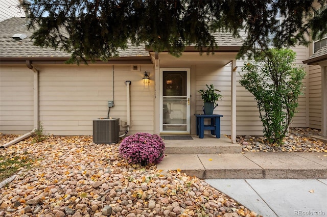 entrance to property featuring central air condition unit